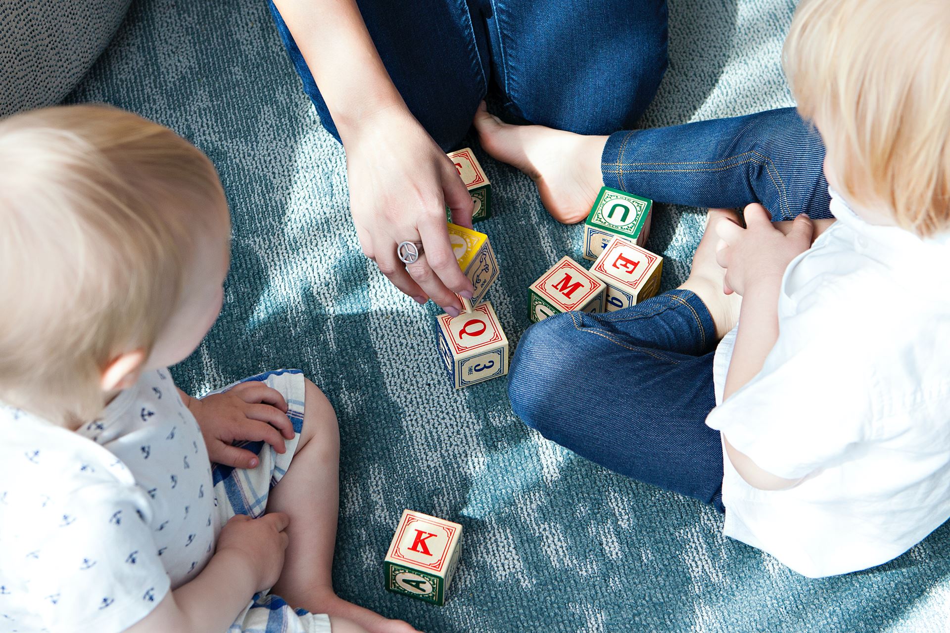 Children sitting and playing with blocks